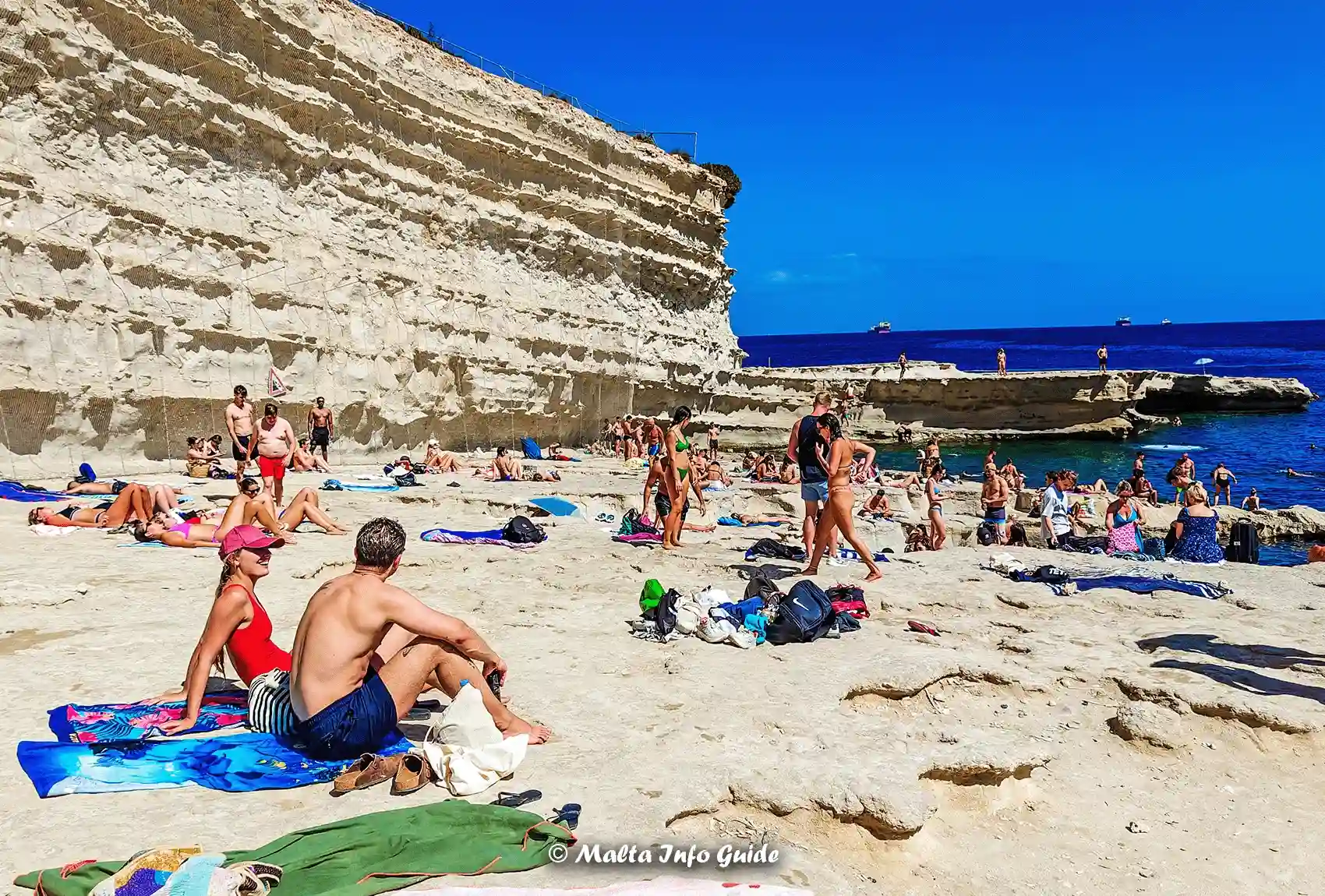 Relaxing and Sunbathing at St. Peter's Pool Marsaxlokk.