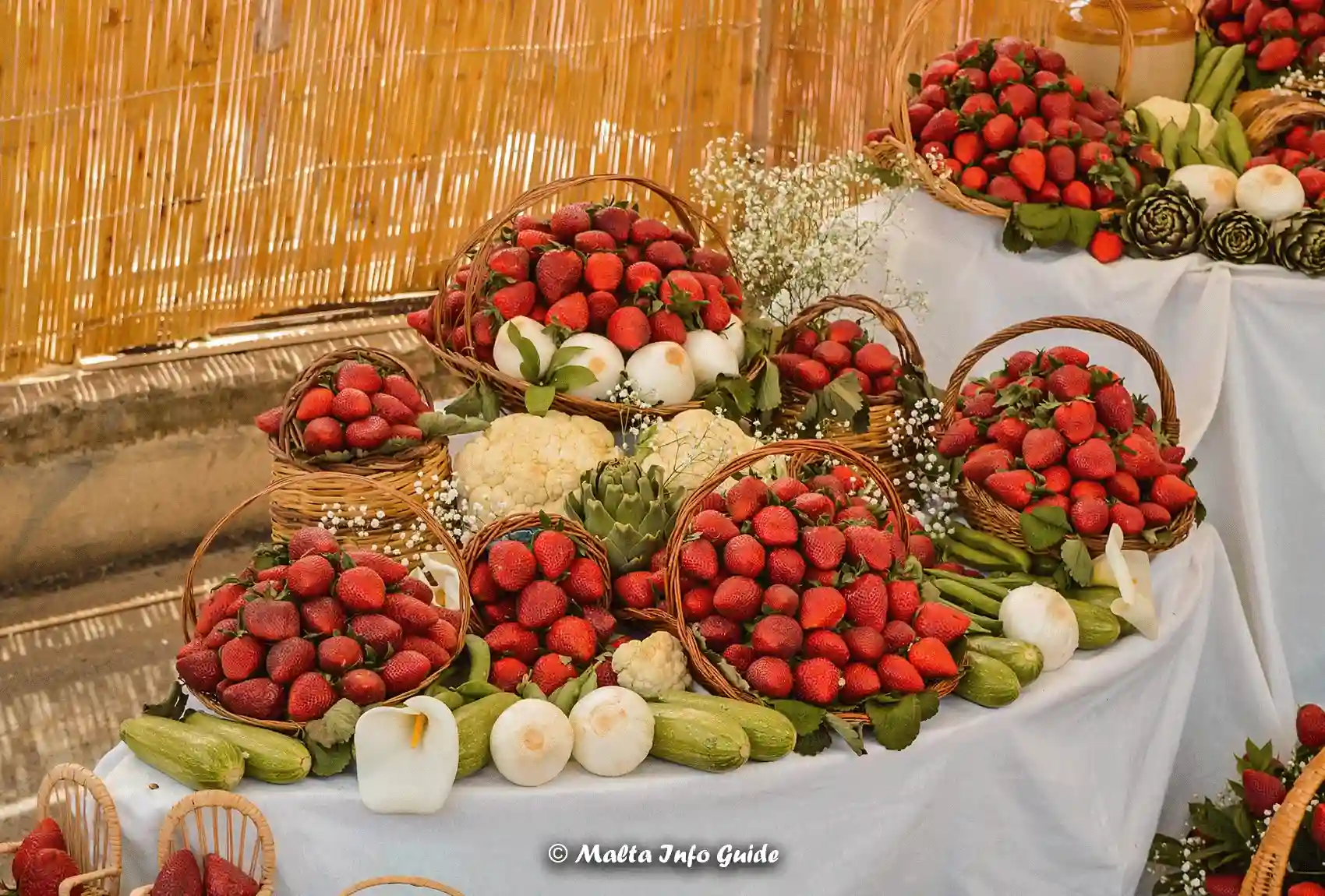 A podium with strawberries commemorating the Strawberry festival in Mgarr Malta. Strawberry Festival in Malta in Mgarr.