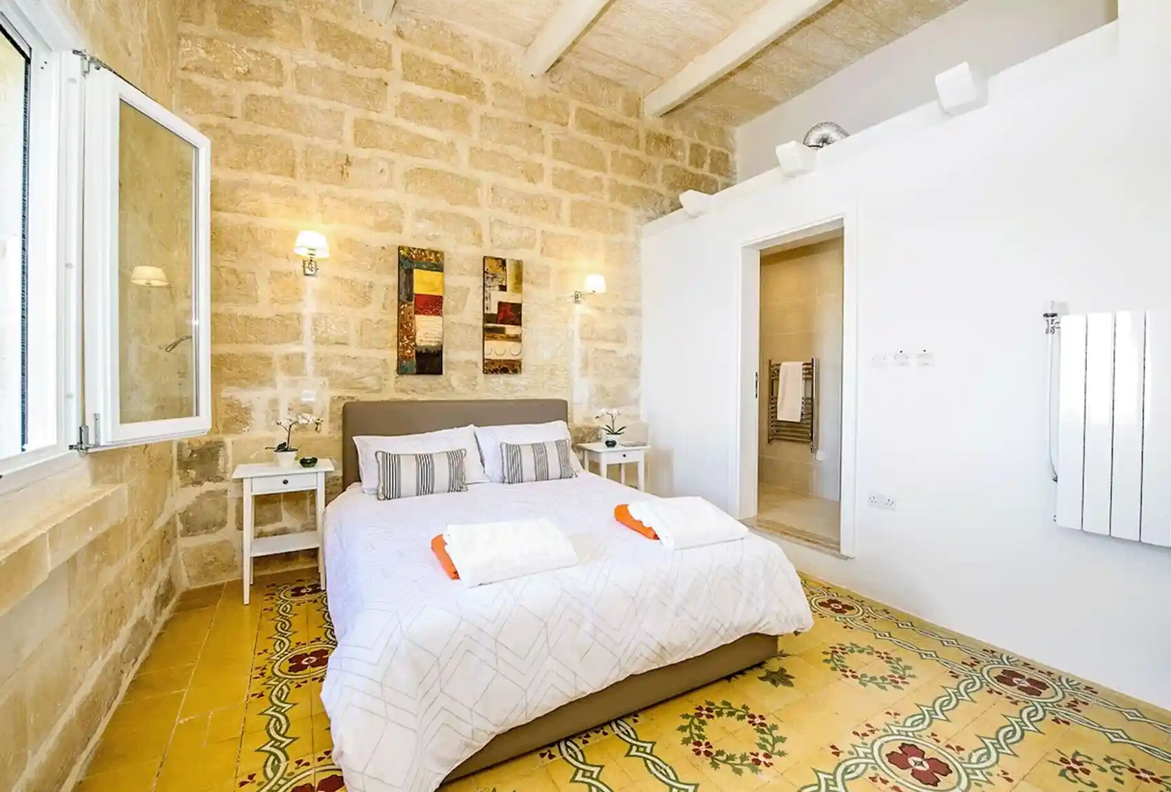 At Sulda Brill Holiday Home in Nadur, Gozo, Malta, with a traditional double bedroom and stone walls.