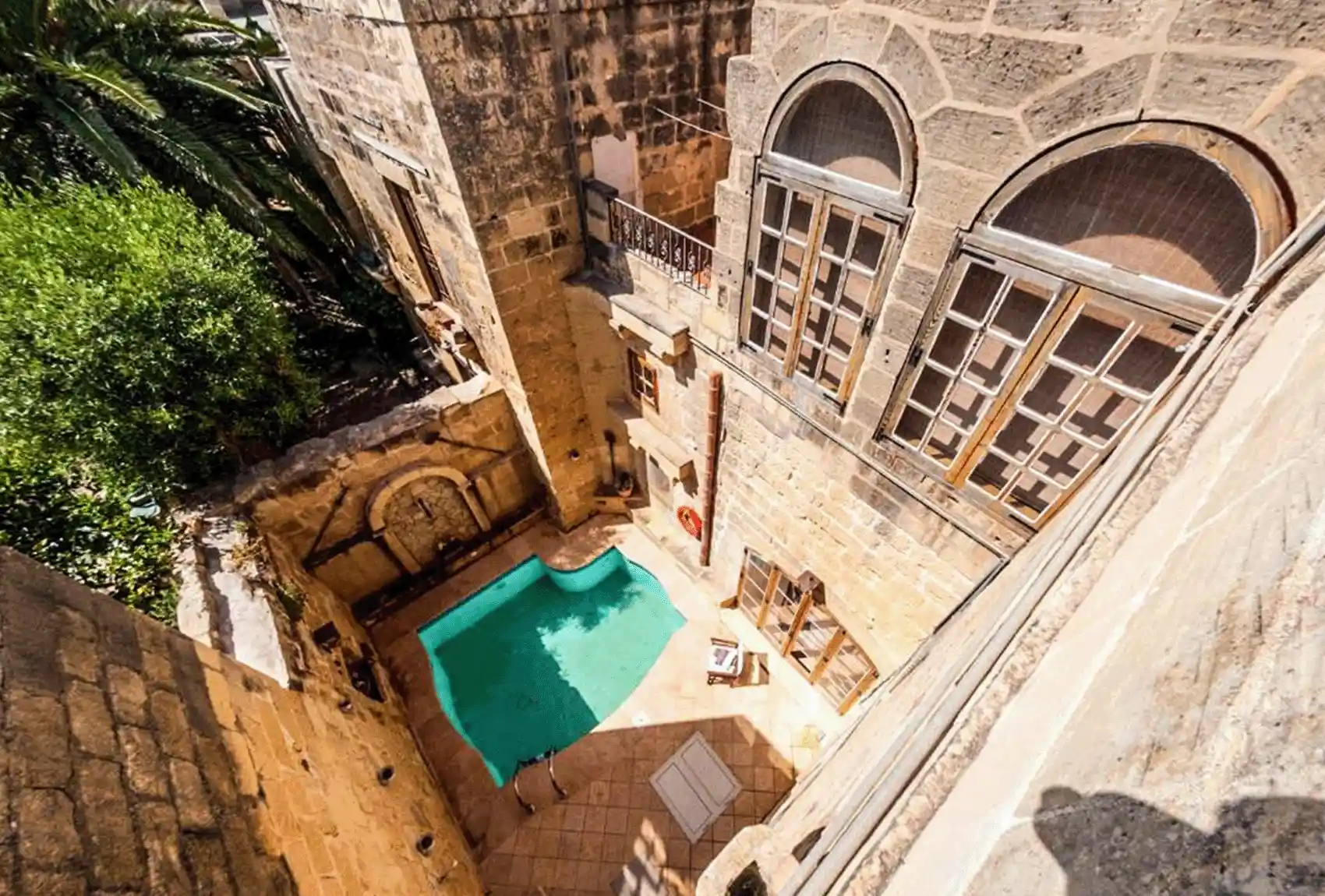 Ta’ Frenc Farmhouse, Għarb, Gozo, Malta, secluded private pool courtyard in traditional limestone.