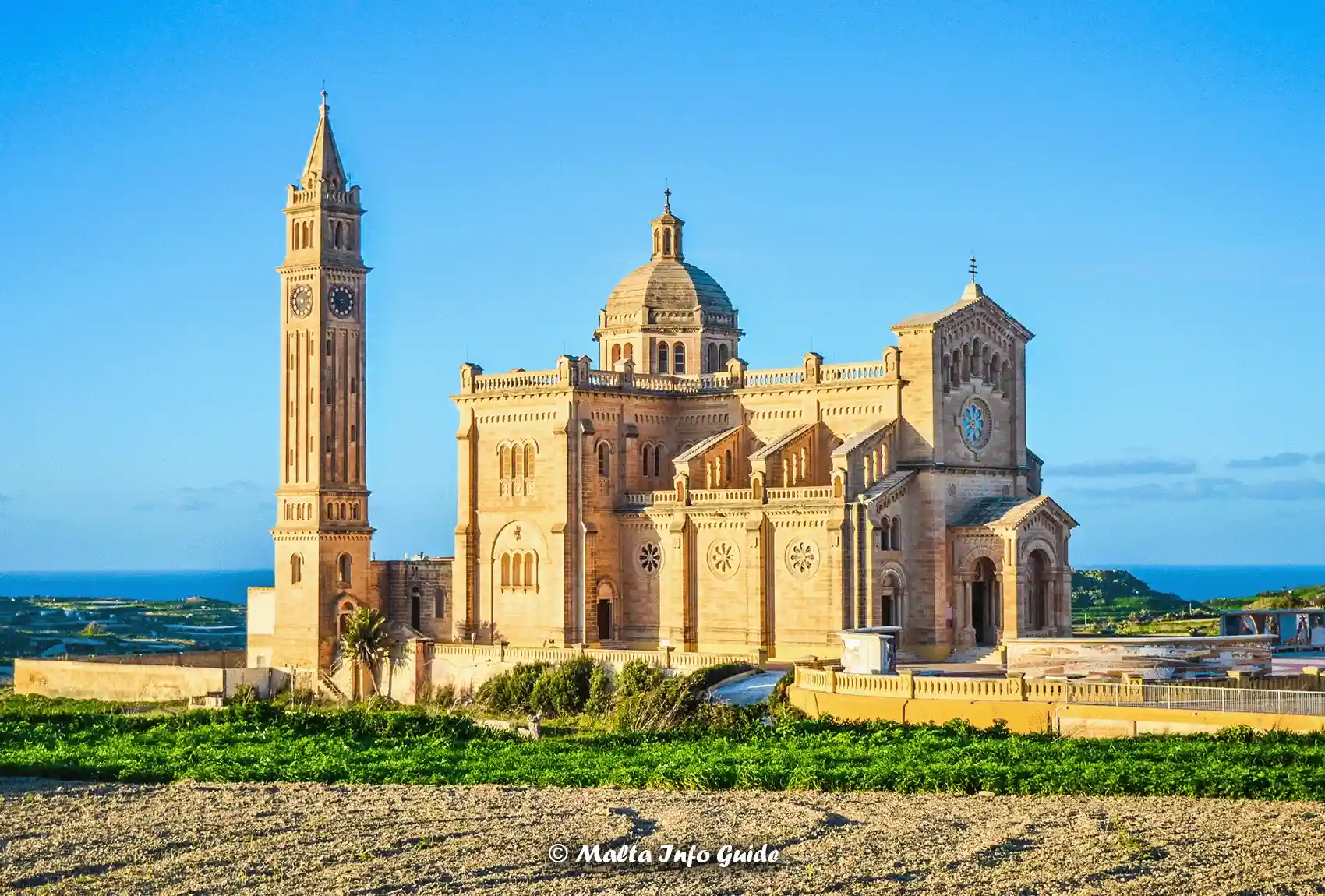 Ta’ Pinu Basilica with blue skies and lush surroundings in Gozo.