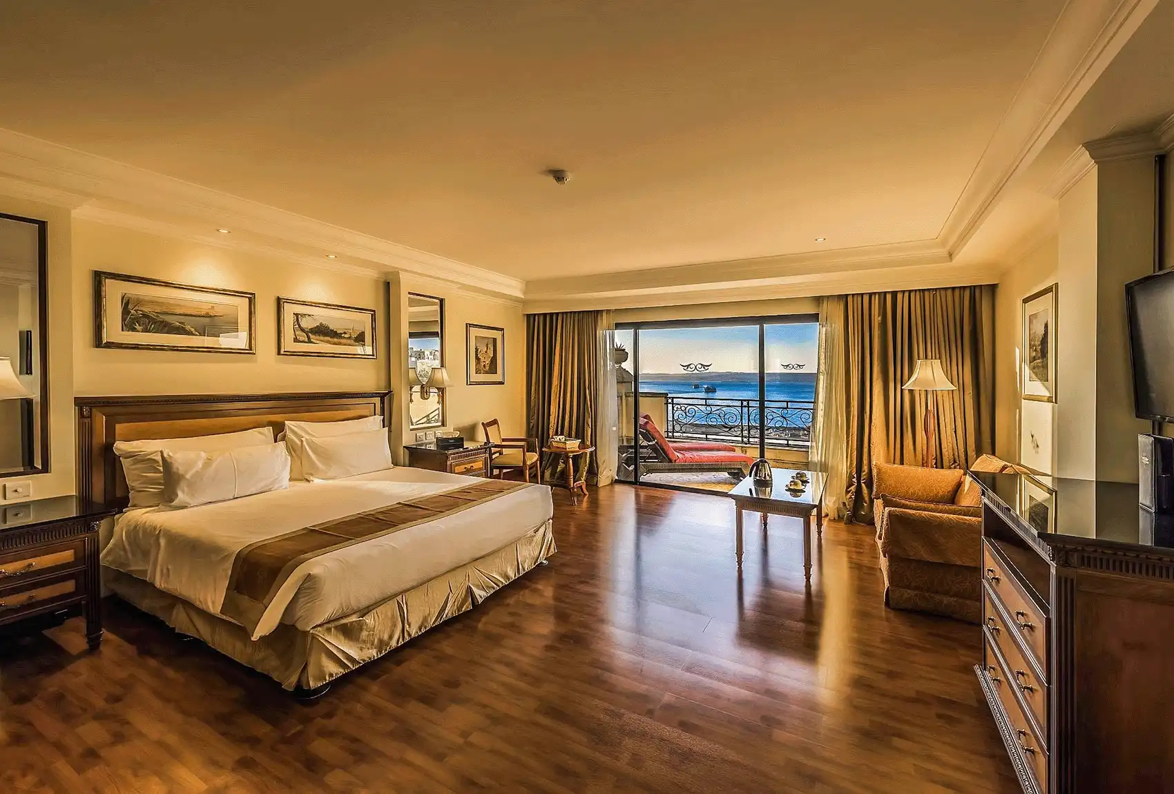A spacious, elegant sea-view bedroom at the Grand Hotel Gozo in Mgarr, Malta