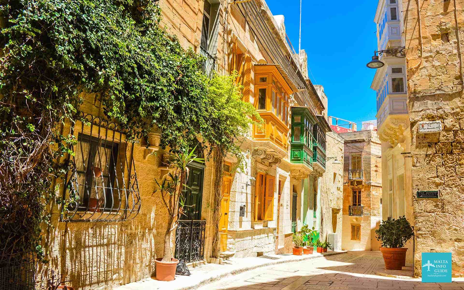 The narrow streets in Birgu with colourful balconies. A fun free thing to do in Malta.