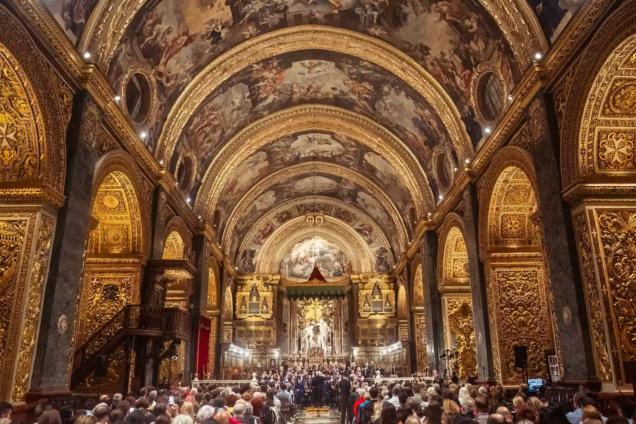 Audience watching a concert during The Three Palaces Festival.