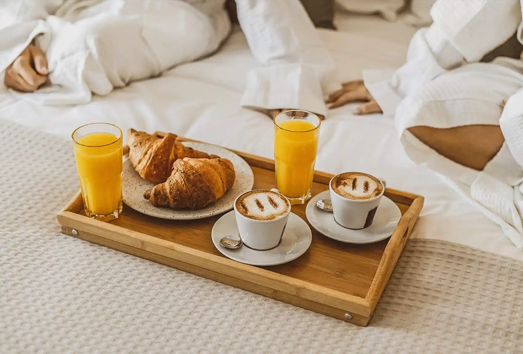 Breakfast tray with croissants, cappuccinos, and orange juice at The Duke Boutique Hotel, Victoria, Gozo, Malta.
