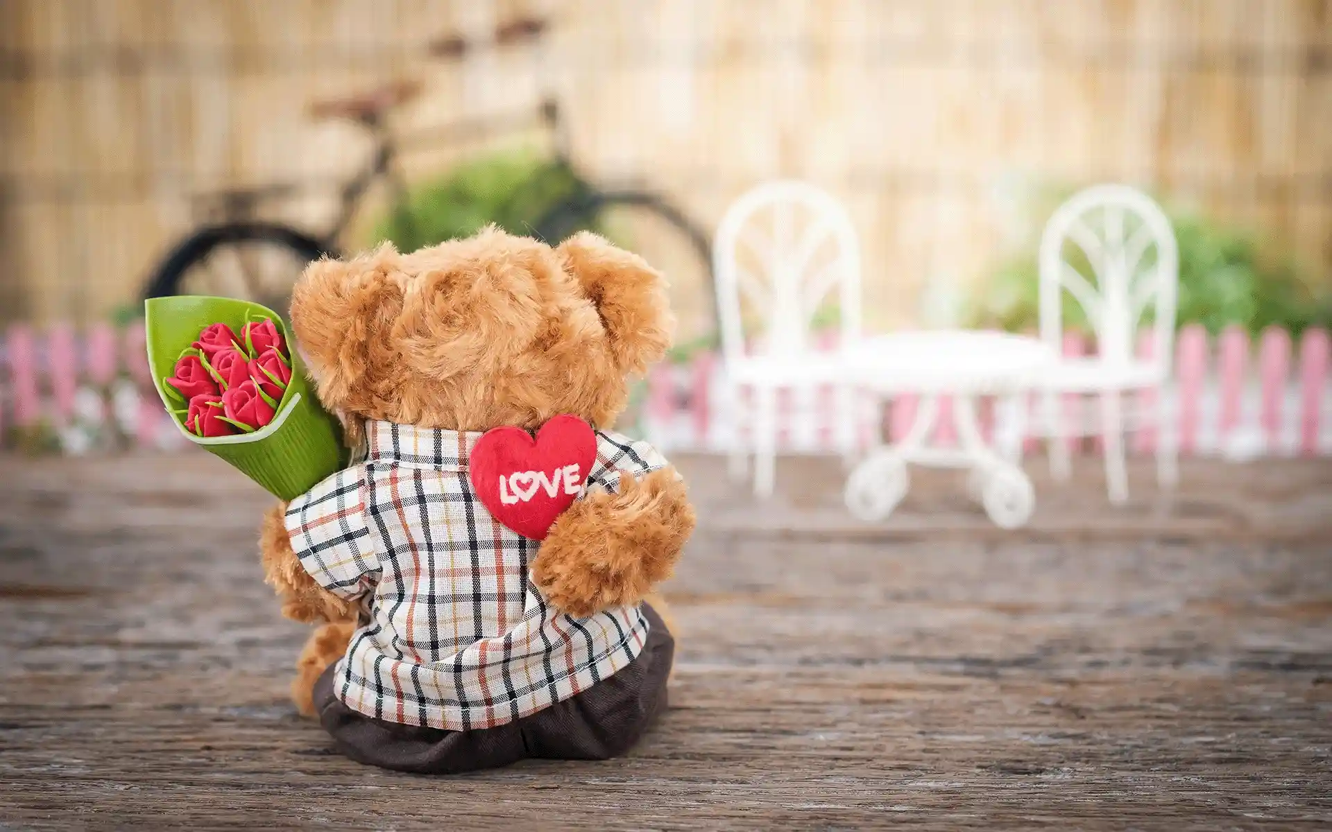 Teddy Bear with a bouquet of flowers.