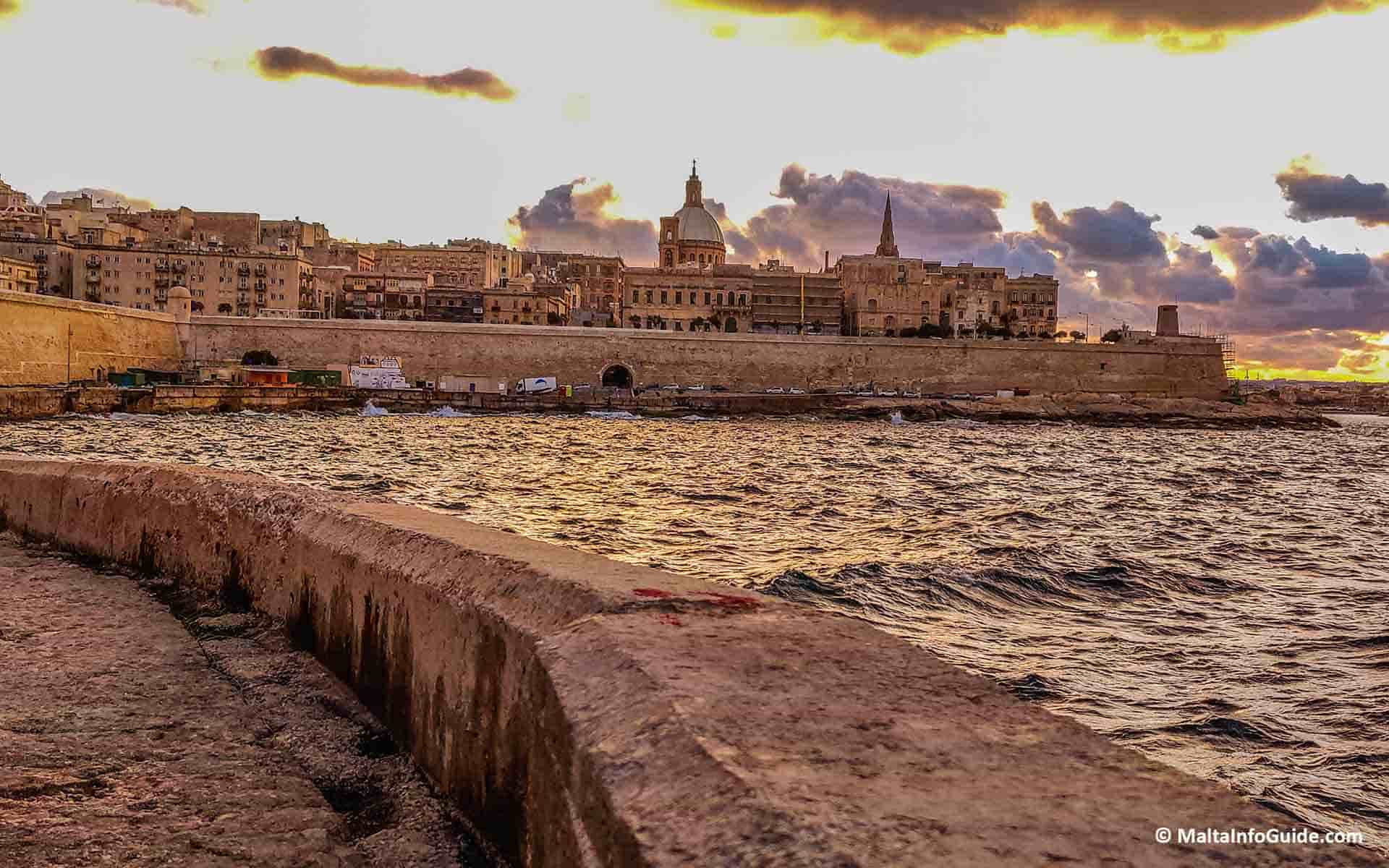 Valletta skyline during sunset on a storymy day.