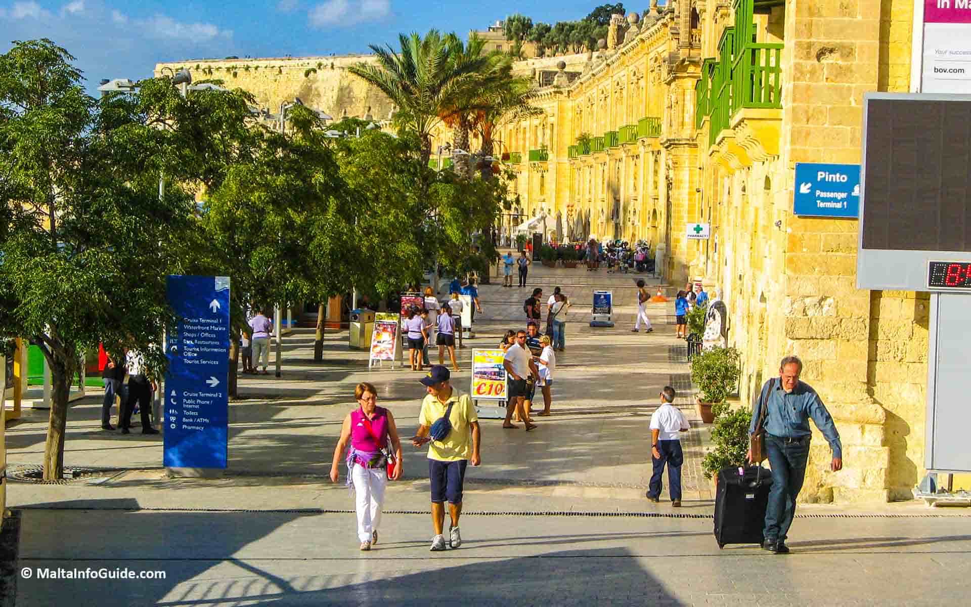 People walking along the promenade at Valletta waterfront.