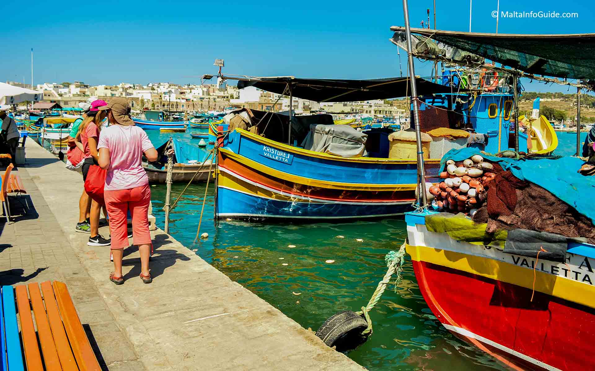 Maltese boats moored at Marsaxlokk village Malta Maltese boats moored at Marsaxlokk village Malta