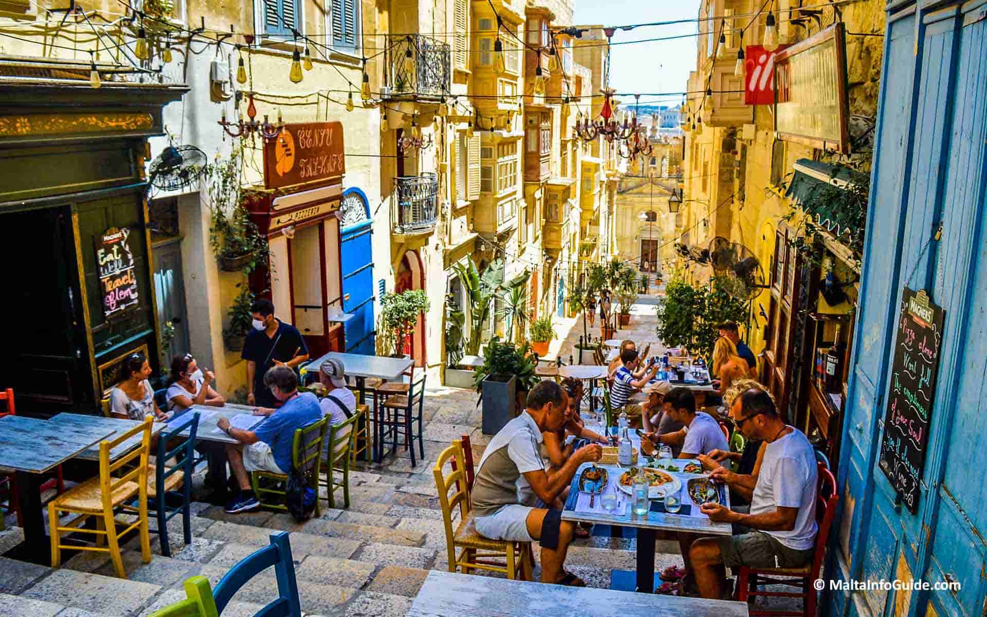 People having lunch at one of the restaurants in Valletta.