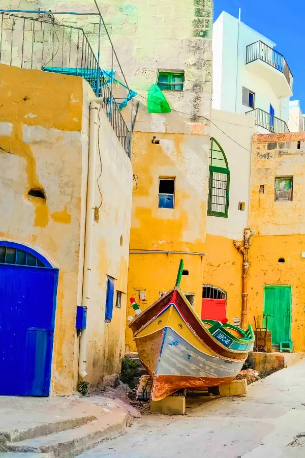 A quiet area with a luzzu boat at Xlendi Gozo.