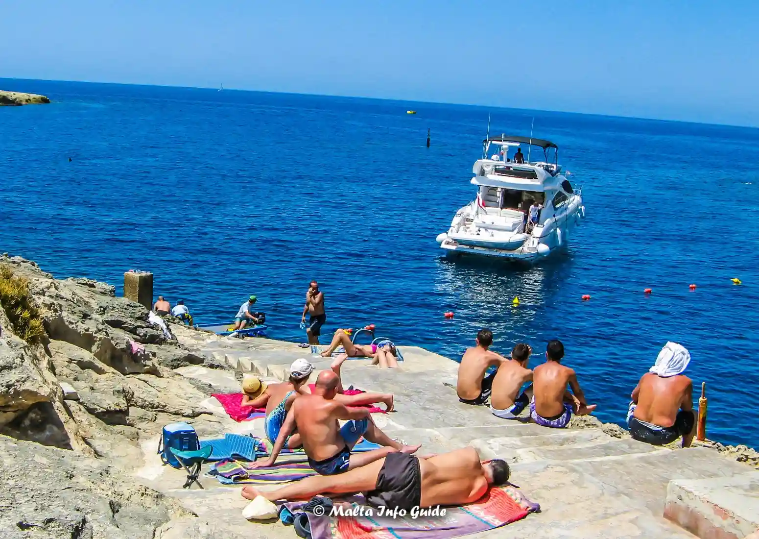 Rocky swimming area at Xlendi Bay in Gozo.